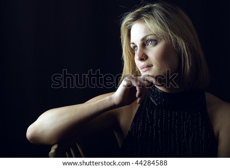 a beautiful blonde woman pondering and thinking