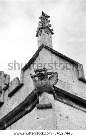 gargoyle on a gothic church in winchcombe, st peter\'s parish church, gloucestershire