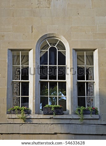 georgian regency window in a sandstone bath stone building, in bath, england, uk