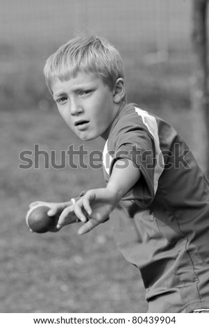 sporty boy fields in cricket game