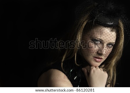 powerful low-key shot of a vintage styled woman
