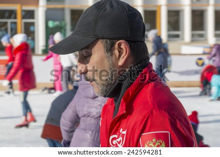 PYATIGORSK, RUSSIA - JANUARY 4, 2015: Trainer at the open-air ice rink