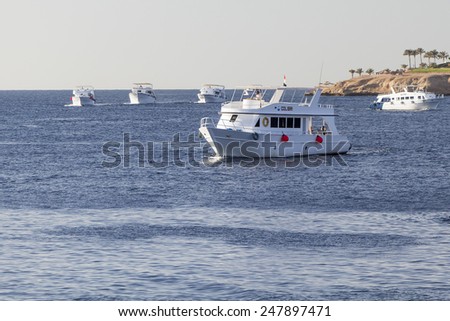 SHARM EL-SHEIKH, EGYPT - DECEMBER 02, 2014: A dive boat is waiting for recreational divers for reaching a diving site.