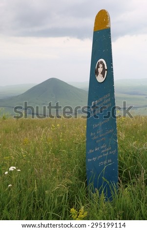Mountain Yutsa, Russia - June 12, 2015: Monument to killed in crash Marina Davydenko (paraglider pilot) on a mountain top. Inscription in Russian: My daughter That was your last flight We all love you