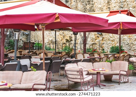 under umbrellas outdoor cafe restaurant kitchen
