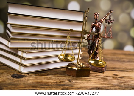 Golden scales of justice, books, Statue of Lady Justice.