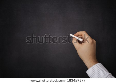 Hand writing on a blackboard Hand writing on a blackboard