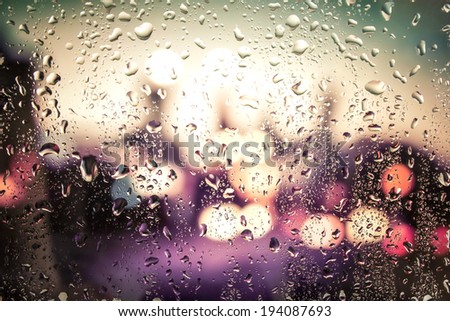 raindrops on glass. Outside the window the evening street