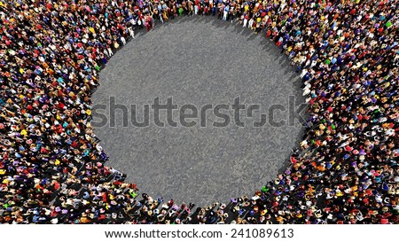 Large group of people seen from above, gathered in the shape of a circle, standing on street pavement background - wide landscape format