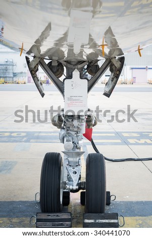 BANGKOK THAILAND - SEPTEMBER, 11 2015 : Airplane wheel on the ground are in parking area at the Donmueang International airport. THAILAND SEPTEMBER, 11 2015