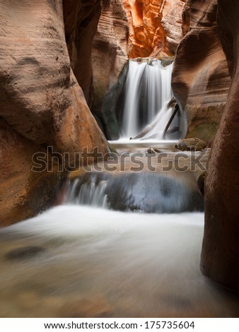 Beautiful Waterfall in the midst of red stones