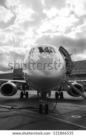 Luxury Business Private Jet plane at airfield black white