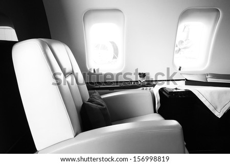black white corporate Business Jet Interior with leather chair