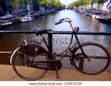 Old bicycle on a bridge in Amsterdam, Holland