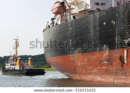 Tanker ship and tug,tugboat on Kiel Canal, Germany