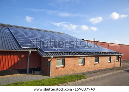 Solar Panels On A Roof Of A Farm Building In Schleswig-Holstein, Germany
