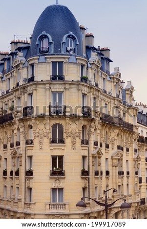 Facade of a traditional apartement building in Paris, France