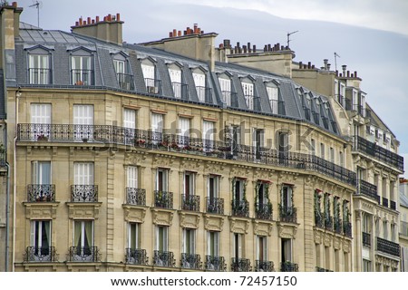 Facade of a traditional living building in Paris, France