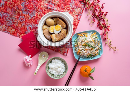 Amazing of Vietnamese food for Tet holiday in spring, it is traditional food on lunar new year: pork belly with hard-boiled eggs braised in coconut water, mixed pickles, rice