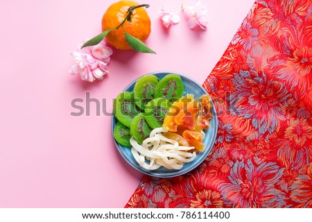 Vietnamese food for Tet holiday in spring, it is traditional food on lunar new year: dried candied fruit kiwi, coconut, papaya
