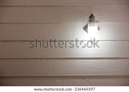 Fluorescent tube on wood plastic wall