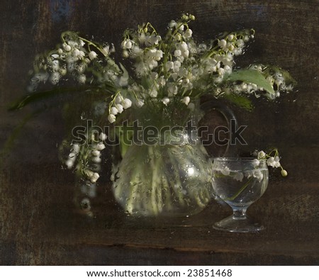 Bouquet of  lilies of the valley of colors in a vase