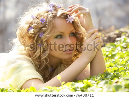 Young girl and spring flowers in her hair
