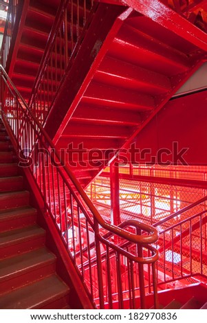 Juxtaposed red fire escape stairs