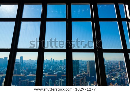 Modern city scape through metal window frames