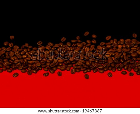 Coffee beans on black and red background