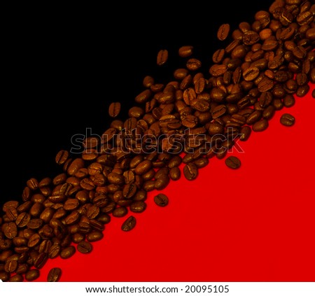 Coffee beans on black and red background
