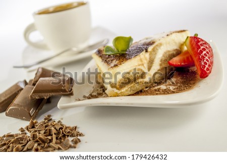 italian desert tiramisu with coffee and strawberry and chocolate on white background