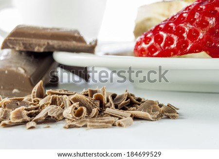italian desert tiramisu with coffe and strawberry and chocolate on white background