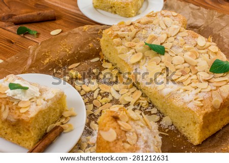 Almond dessert with sugar and mint leaf on wood table