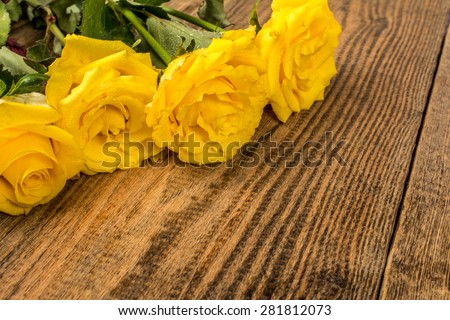 Flowers yellow roses on wood background photography