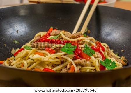 Chinese traditional food noodles with chicken meat and vegetables