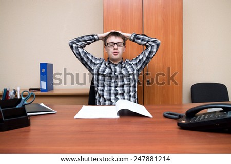 office worker. young office worker tired of working