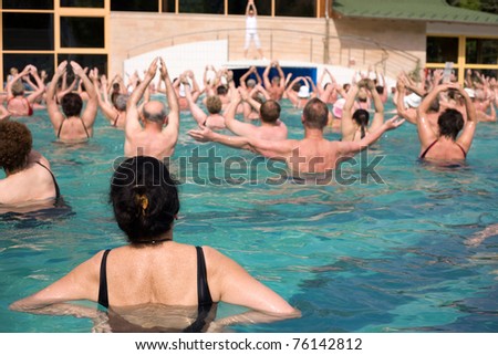 Group of gym people in a thermal swimming pool, in Harkany, Hungary. Focused on the front.