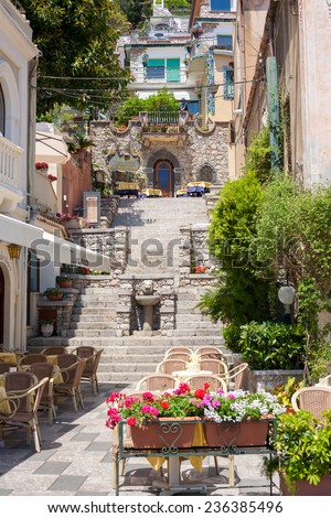 TAORMINA, ITALY - MAY 11, 2012: A street detail with restaurants in Taormina in Sicily, Italy