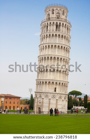 PISA, ITALY - NOV 24, 2014: Tourist around Leading Tower of Piazza dei Miracoli in Pisa, Italy
