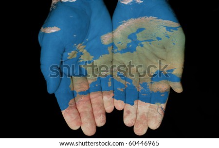 Map painted on hands showing concept of having Europe in our hands