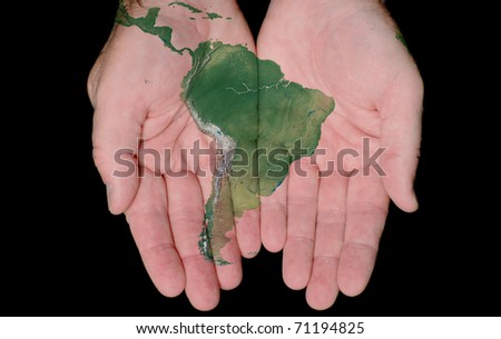 Map Of South America Painted On Hands Showing Concept Of South America In Our Hands