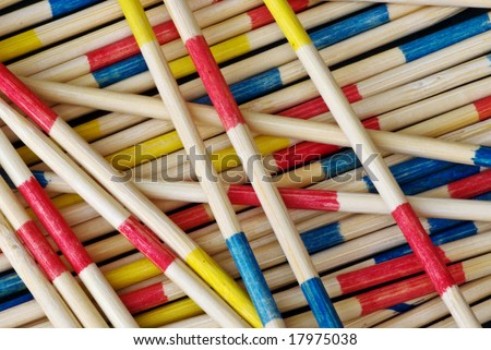 A macro shot of a child\'s pick up sticks game