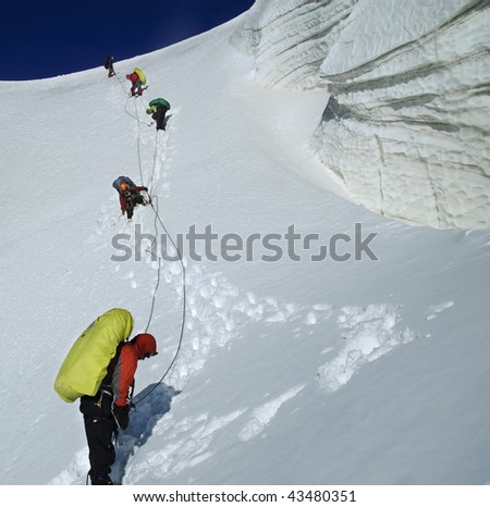 Roped team descending the icefall. Kuylu mountains, Central Tien-Shan, Kyrgyzstan.