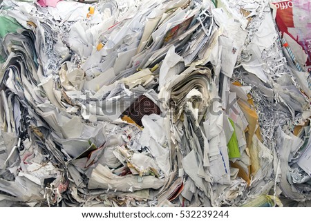 cardboard and paper piled and ready to recycle