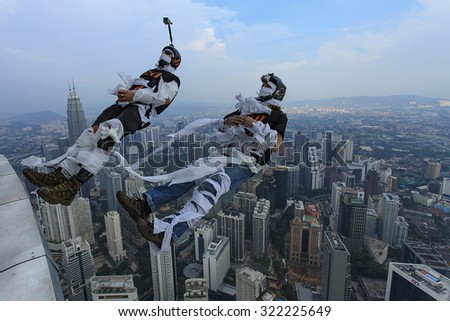 Kuala Lumpur, Malaysia-September 30, 2011: A BASE jumpers in jumps off from KL Tower. KL Tower BASE Jump is an annually event and participants from experienced BASE jumpers from all around the world.