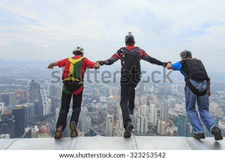 Kuala Lumpur, Malaysia-September 30, 2011: A BASE jumpers in jumps off from KL Tower. KL Tower BASE Jump is an annually event and participants from experienced BASE jumpers from all around the world.