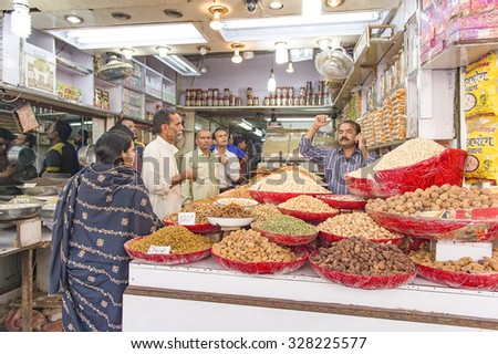 Delhi, India-November 03, 2014:Unidentified  spice vendor selling a variety of spices in the street of Old Delhi. Spice is a most important ingredient for cooking in India.