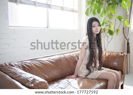 Young woman sitting on the couch