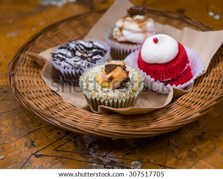 4 Cupcake Flavors On A Wicker Tray (Chocolate Cheese Cupcake,Caramel Coffee Cupcake,Red Velvet Cupcake and mango chocolate cupcake)